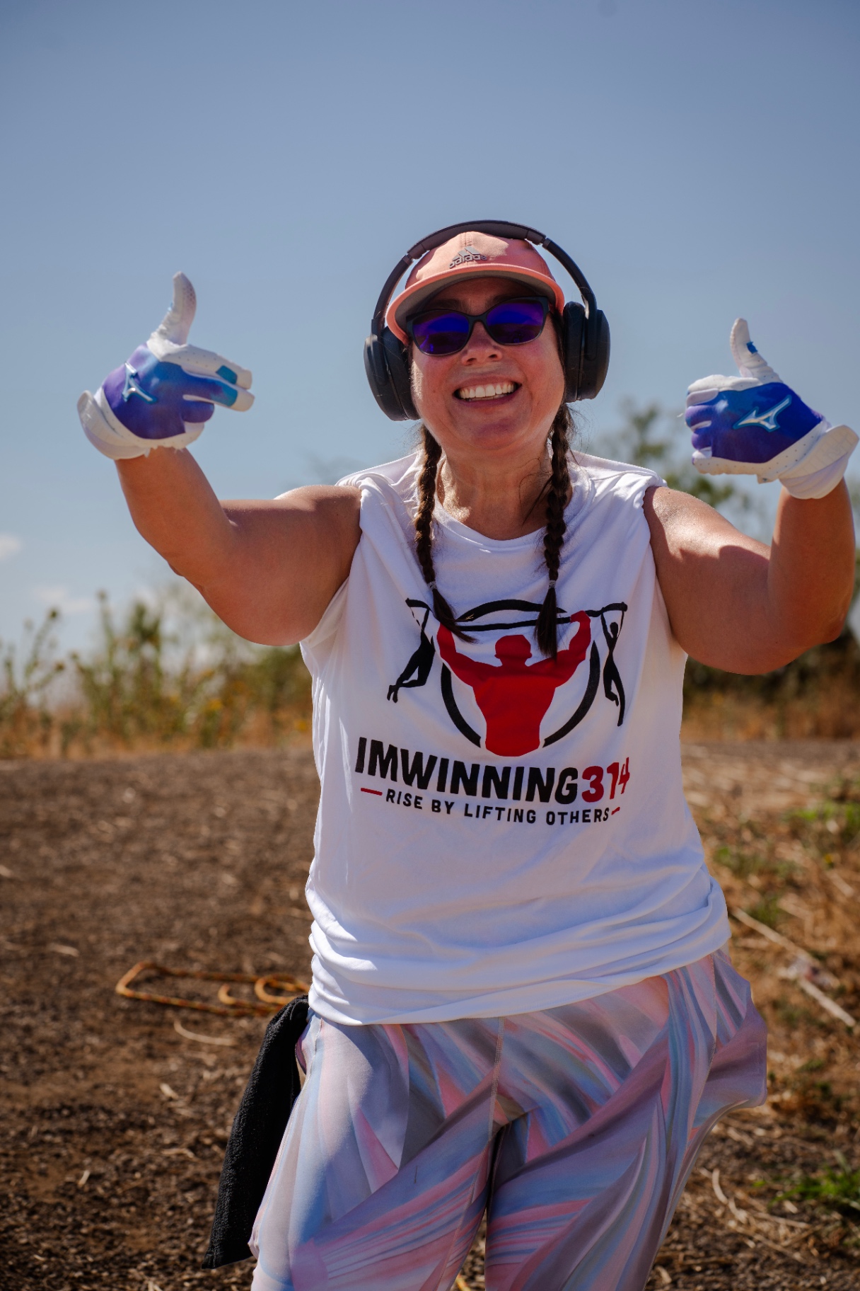Member giving two thumbs up at outdoor workout