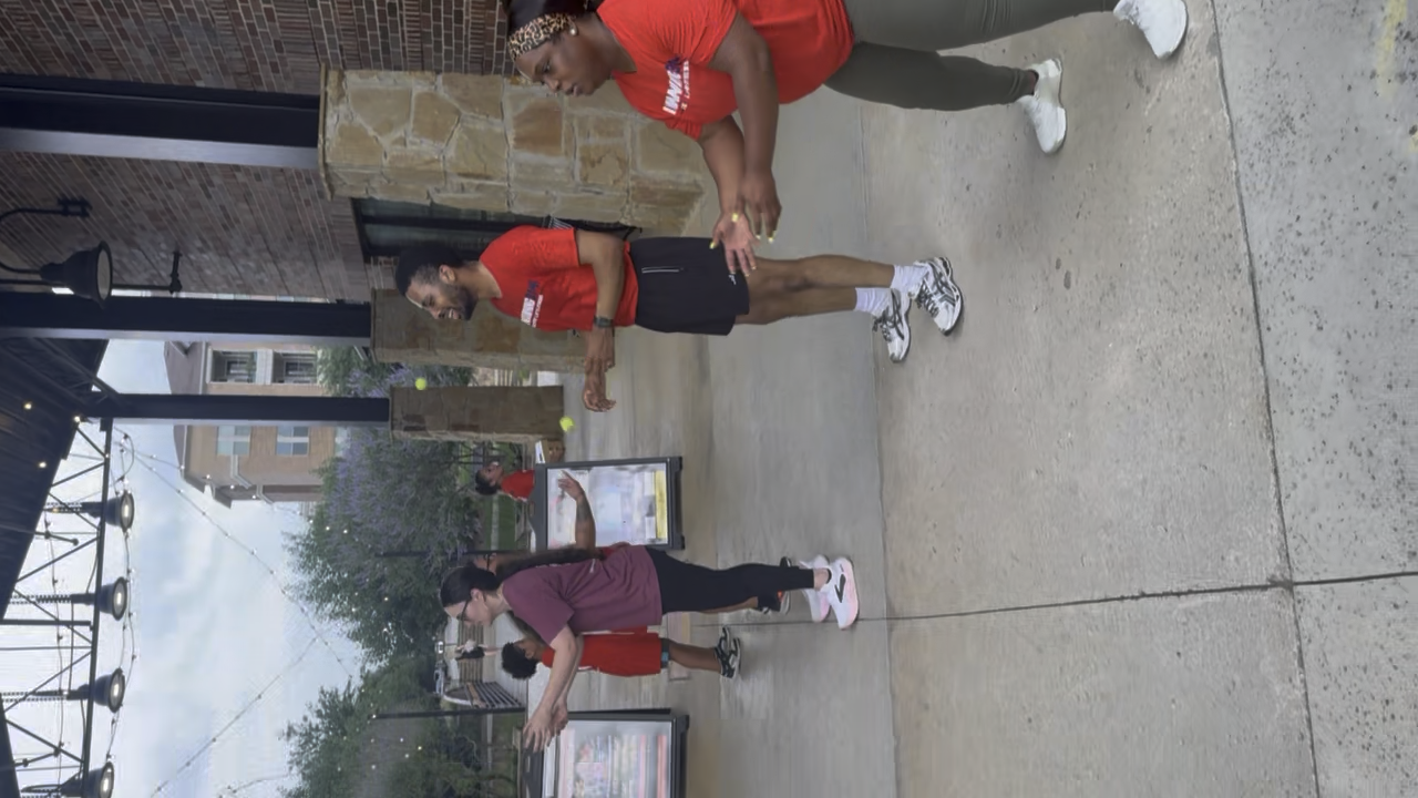 Coaches training members at Wayne Ferguson Plaza