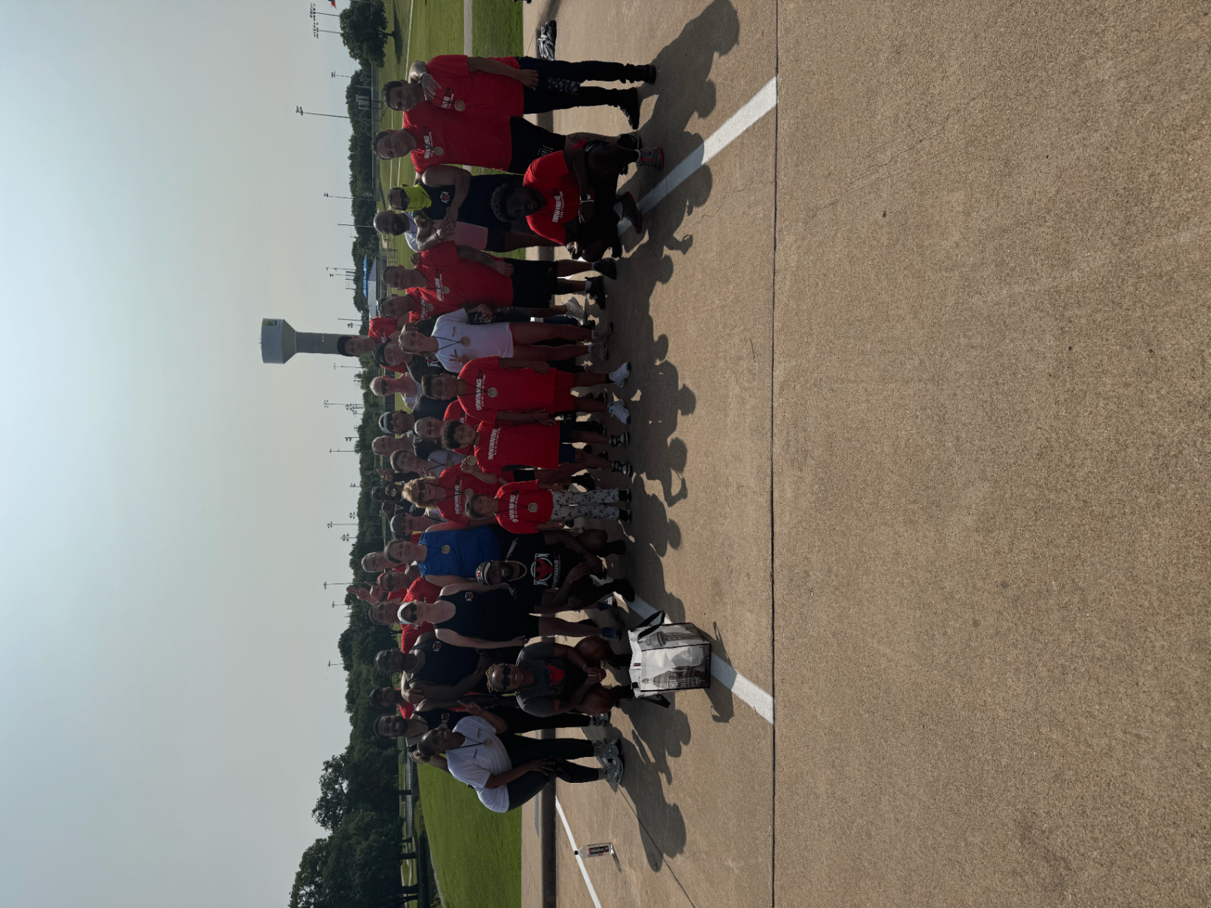 ImWinning314 team in red shirts at an outdoor event